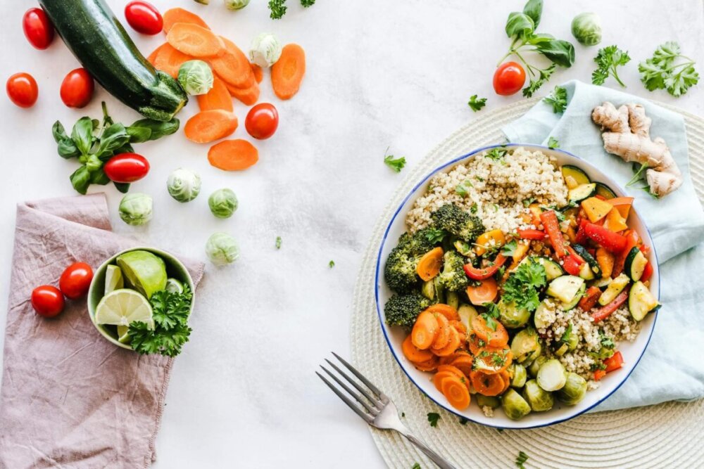 Colourful quinoa salad with fresh vegetables creates a healthy, balanced meal, foundation to the journey of a happier and healthier