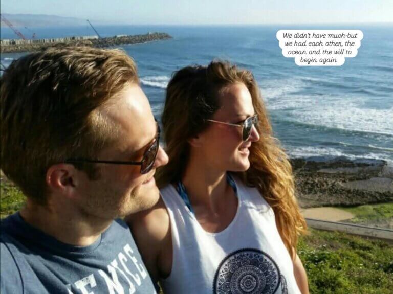 Couple gazing at the ocean, sunlight on their faces — symbolising a shared emotional reset and the quiet strength of beginning again.