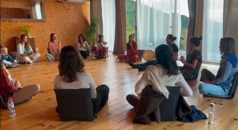Family participating in a creative singing workshop, with child joyfully engaging — a shared ritual of emotional expression and connection